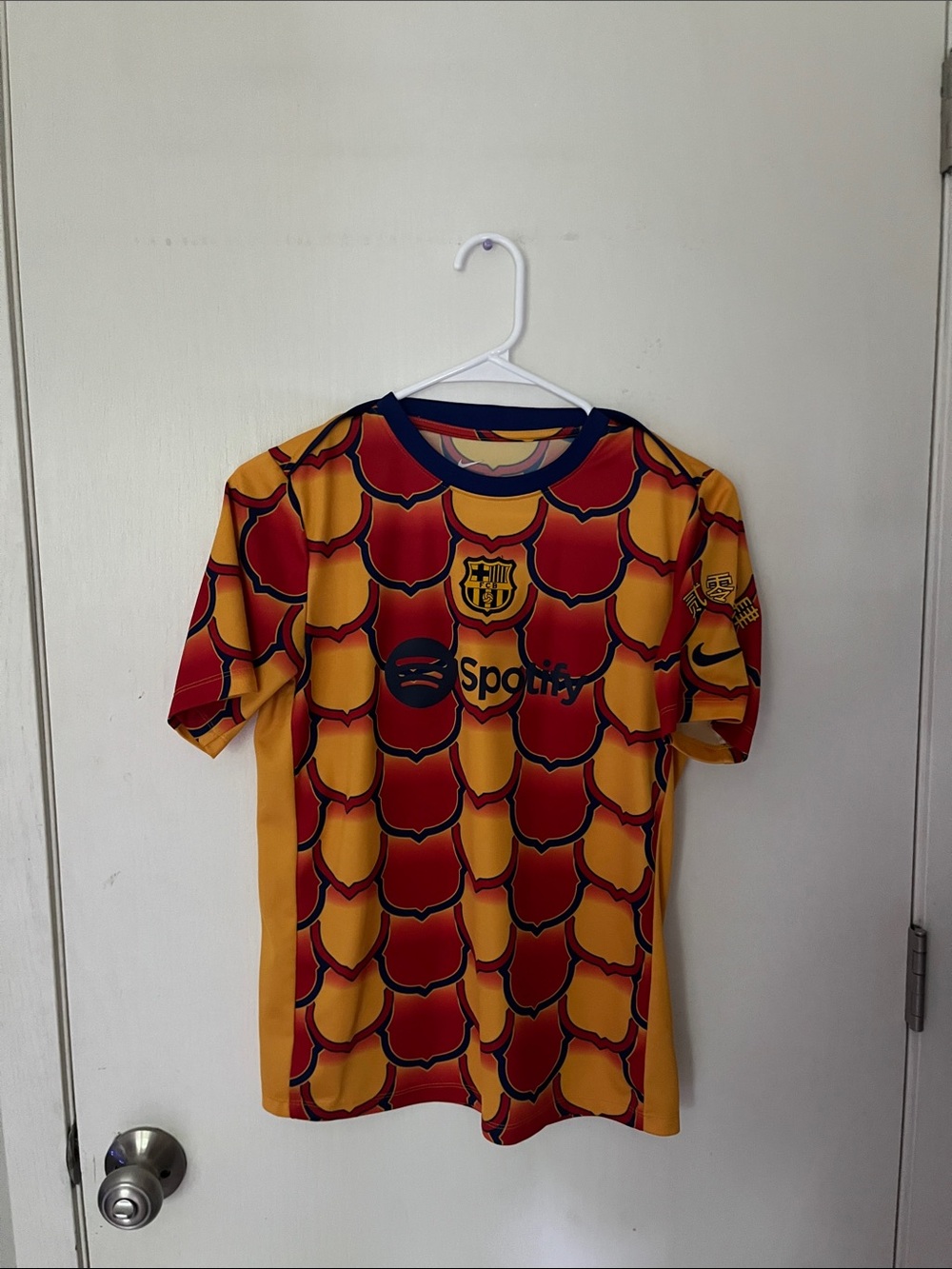 Nike FC Barcelona 2023-24 Academy Pro Pre-Match Top in University Gold.